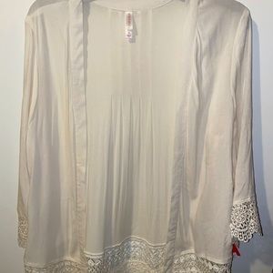 Medium cream cardigan with beautiful cutout detail